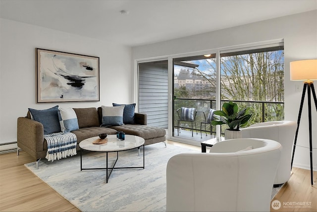 19428 Aurora Ave N Unit 433, Shoreline, WA 98133 - living area with light wood-type flooring and a baseboard heating unit
