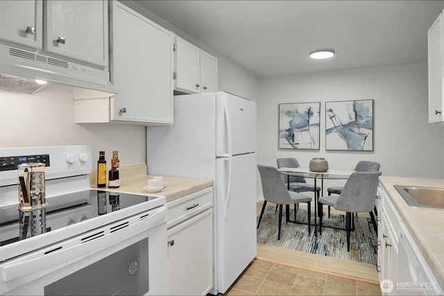 19428 Aurora Ave N Unit 433, Shoreline, WA 98133 - kitchen featuring white appliances, under cabinet range hood, white cabinets, and light countertops