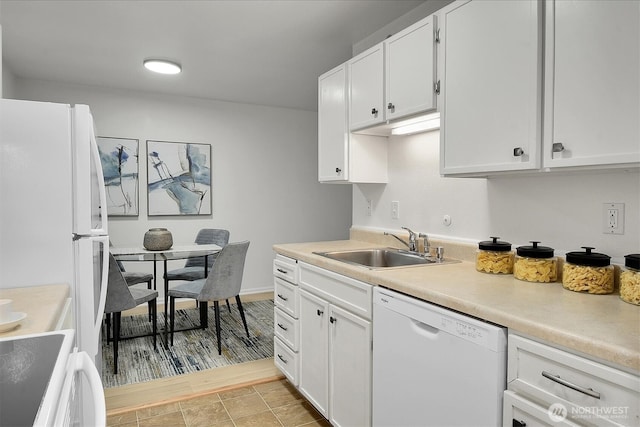 19428 Aurora Ave N Unit 433, Shoreline, WA 98133 - kitchen with white dishwasher, a sink, light countertops, and white cabinets