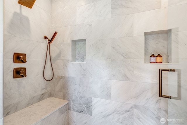 full bathroom with a tile shower