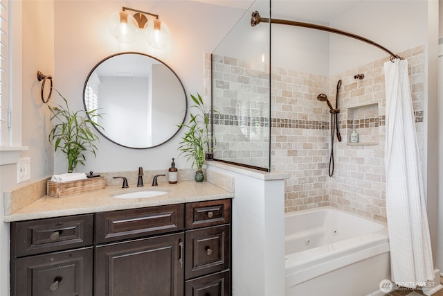 full bathroom featuring a combined bath / shower with jetted tub and vanity
