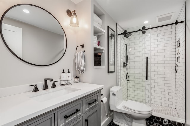 bathroom with toilet, a stall shower, vanity, and recessed lighting