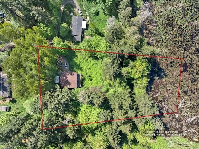 aerial view of property and surrounding area with property boundaries highlighted