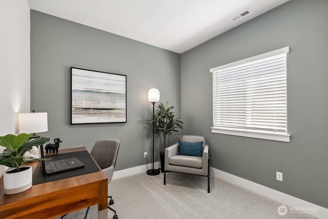 office area with visible vents, baseboards, and carpet floors