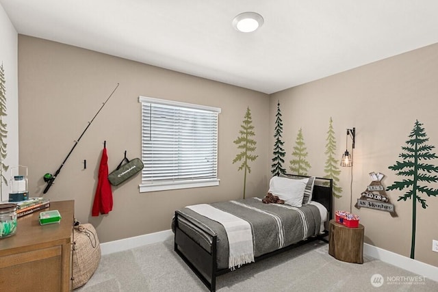 carpeted bedroom with baseboards