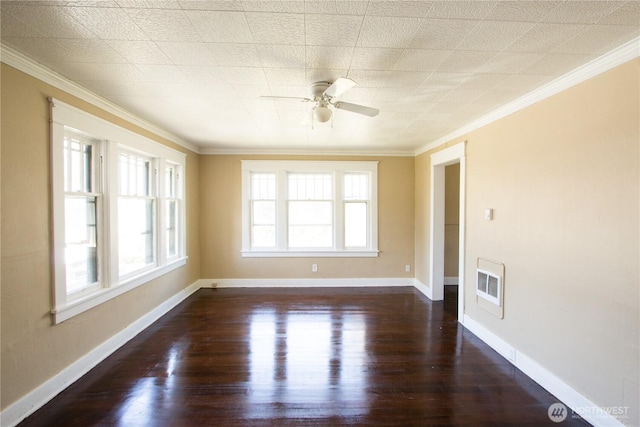 618 Coolidge Rd, Aberdeen, WA 98520 - spare room featuring crown molding, dark wood-style floors, ceiling fan, and heating unit