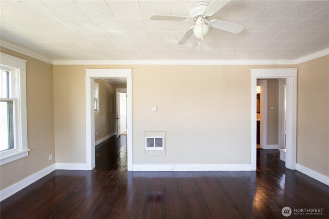 618 Coolidge Rd, Aberdeen, WA 98520 - spare room with heating unit, wood finished floors, ornamental molding, and a ceiling fan