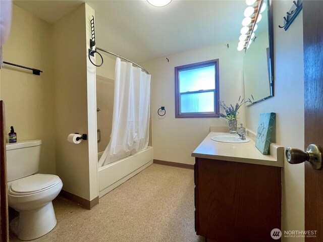 bathroom with toilet, baseboards, vanity, and shower / bath combination with curtain