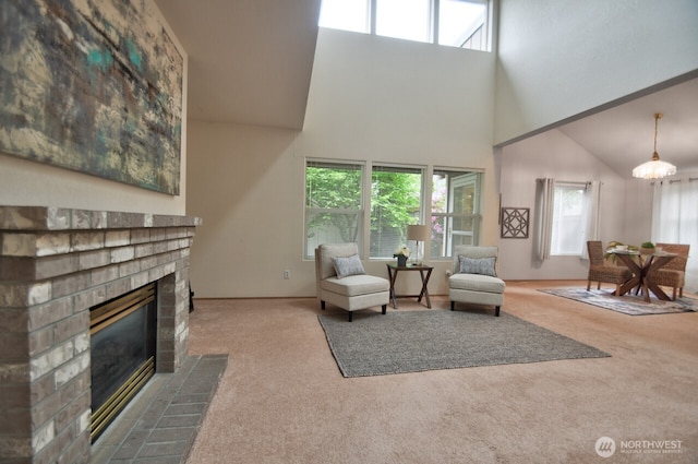 4323 Beaumont Ln SE, Lacey, WA 98503 - living area with carpet, a towering ceiling, and a fireplace