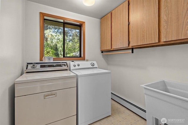 565 Olympic View Ln, Camano Island, WA 98282 - laundry area featuring independent washer and dryer, baseboard heating, and cabinet space