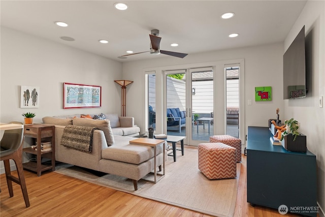 living area featuring ceiling fan, light wood-type flooring, and recessed lighting