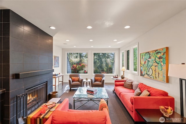 living area with a fireplace, carpet flooring, baseboards, and recessed lighting