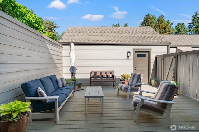 deck featuring fence and an outdoor living space