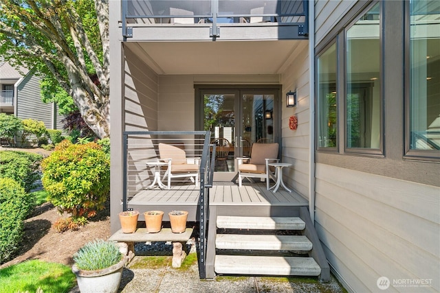 entrance to property featuring french doors and a balcony
