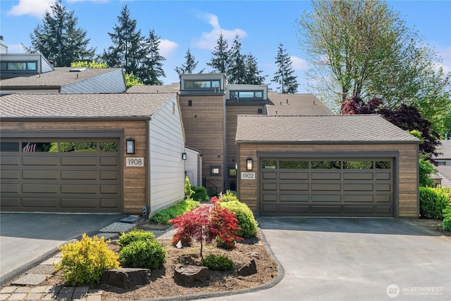 view of front of home with driveway and a garage