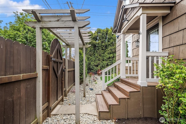 view of property exterior featuring a gate and fence