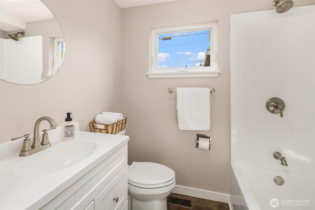 full bathroom with toilet, baseboards, bathing tub / shower combination, and vanity