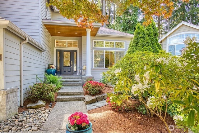 doorway to property with a porch