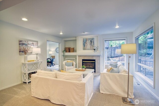 living area with carpet floors, a fireplace, recessed lighting, and baseboards