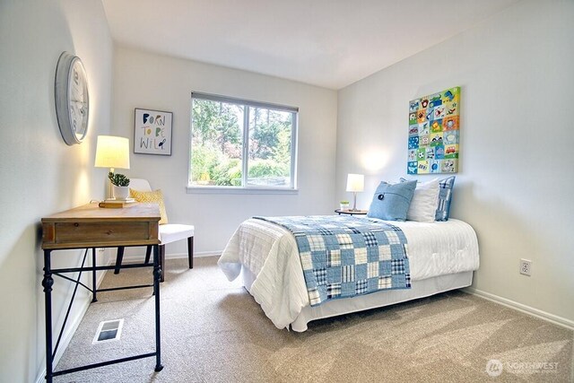 carpeted bedroom with baseboards