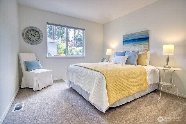 carpeted bedroom with baseboards