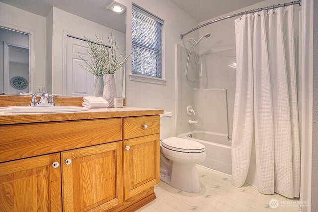 bathroom featuring toilet, vanity, shower / tub combo, and tile patterned floors