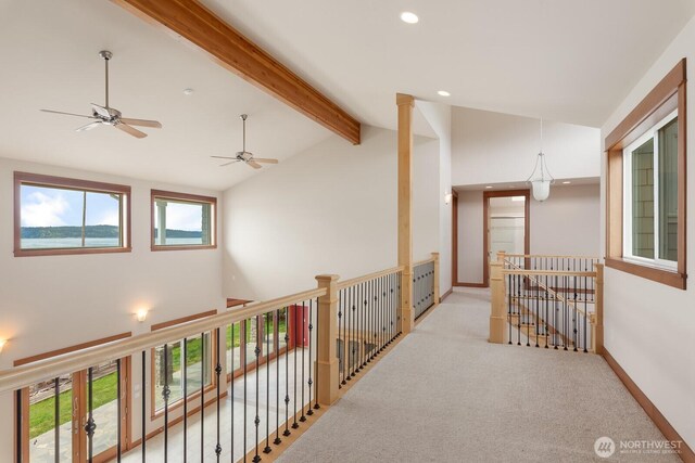 hallway featuring carpet flooring, recessed lighting, and an upstairs landing
