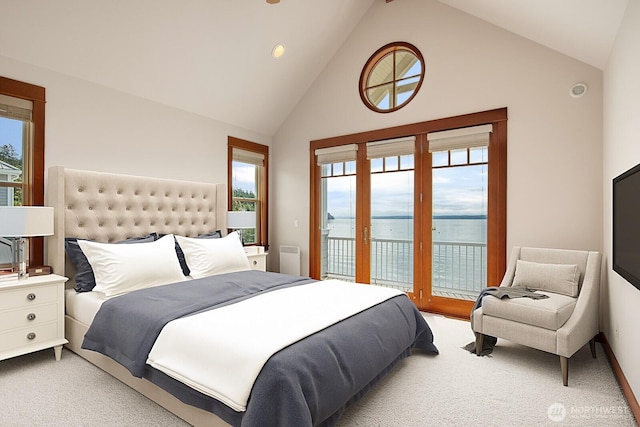 bedroom featuring access to outside, carpet, multiple windows, and high vaulted ceiling