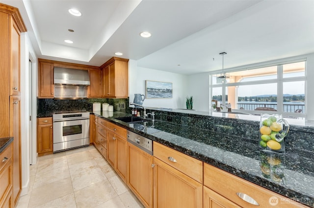 2015 SE Columbia River Dr Unit 320, Vancouver, WA 98661 - kitchen with range, dishwasher, a sink, decorative backsplash, and wall chimney exhaust hood