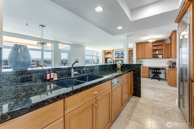 2015 SE Columbia River Dr Unit 320, Vancouver, WA 98661 - kitchen with a sink, dark stone countertops, open shelves, recessed lighting, and pendant lighting
