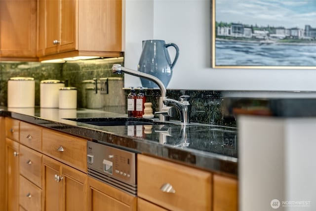 2015 SE Columbia River Dr Unit 320, Vancouver, WA 98661 - kitchen with a sink, tasteful backsplash, and dark countertops