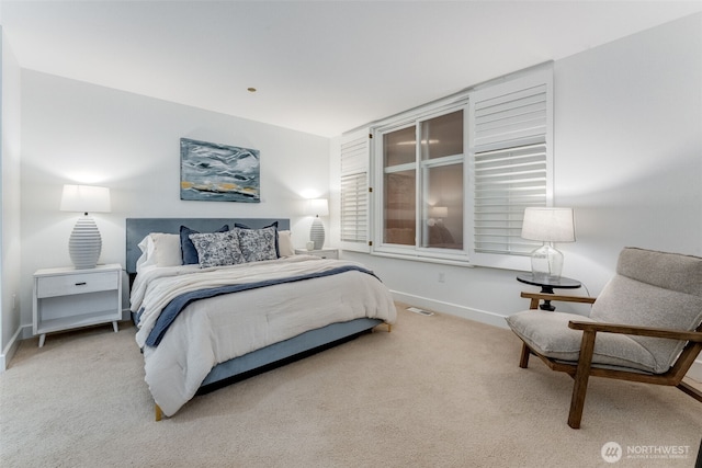 2015 SE Columbia River Dr Unit 320, Vancouver, WA 98661 - bedroom featuring visible vents, baseboards, and carpet floors