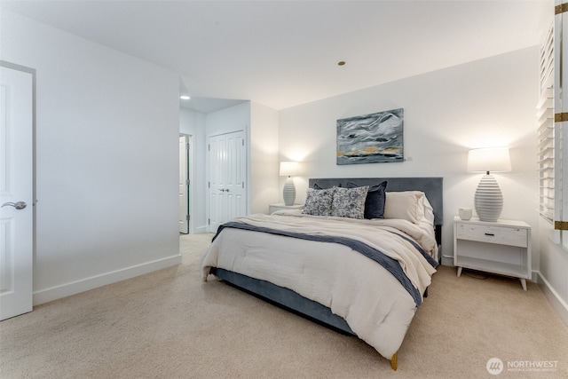 2015 SE Columbia River Dr Unit 320, Vancouver, WA 98661 - bedroom with light colored carpet, baseboards, and a closet