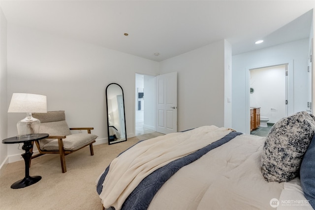 2015 SE Columbia River Dr Unit 320, Vancouver, WA 98661 - bedroom featuring light colored carpet, connected bathroom, baseboards, and recessed lighting