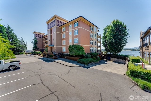 2015 SE Columbia River Dr Unit 320, Vancouver, WA 98661 - view of property featuring uncovered parking and a water view