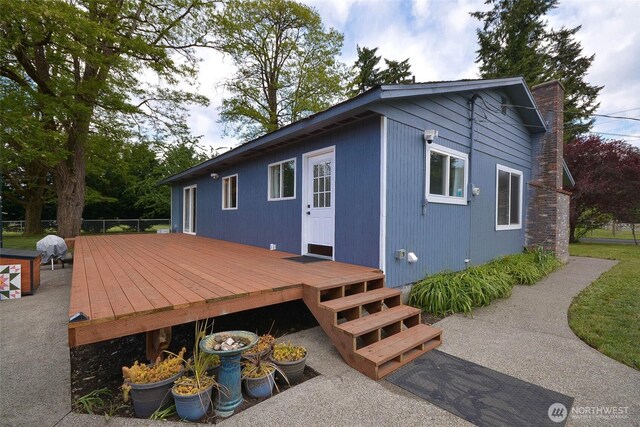 20005 Carper Rd SW, Rochester, WA 98579 - view of side of home with a wooden deck and a chimney