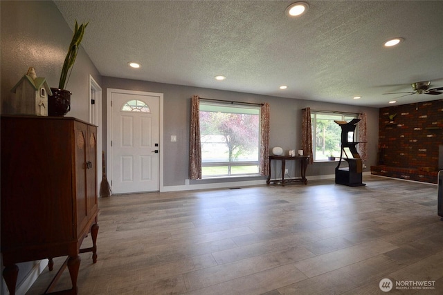 20005 Carper Rd SW, Rochester, WA 98579 - foyer featuring a textured ceiling, wood finished floors, a ceiling fan, recessed lighting, and baseboards
