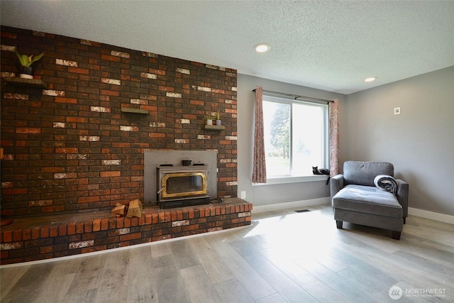 20005 Carper Rd SW, Rochester, WA 98579 - living area with baseboards, wood finished floors, a textured ceiling, and recessed lighting