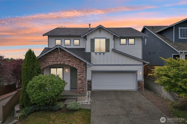 27859 256th Ct SE, Maple Valley, WA 98038 - traditional-style home with board and batten siding, stone siding, concrete driveway, and an attached garage