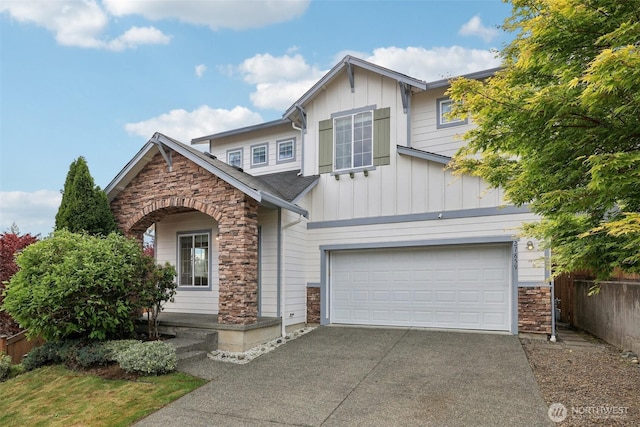 27859 256th Ct SE, Maple Valley, WA 98038 - view of front facade featuring stone siding, board and batten siding, driveway, and an attached garage