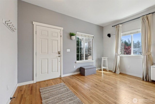 27859 256th Ct SE, Maple Valley, WA 98038 - entryway featuring healthy amount of natural light, wood-type flooring, and baseboards