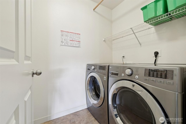 27859 256th Ct SE, Maple Valley, WA 98038 - washroom featuring washing machine and dryer and baseboards