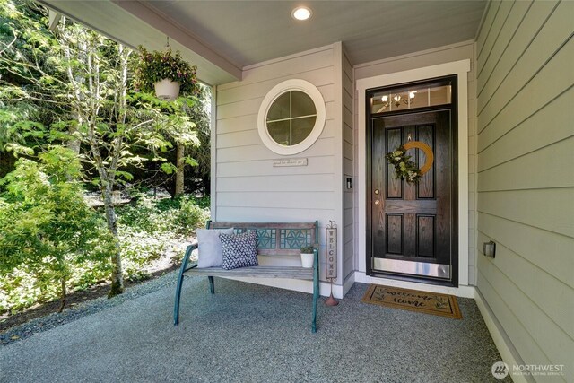 doorway to property featuring covered porch