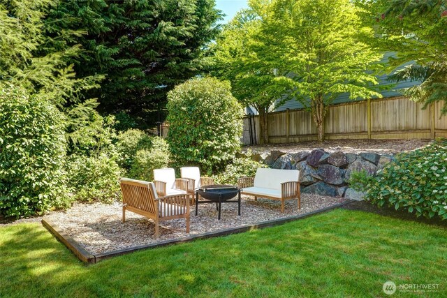 view of yard with a fire pit