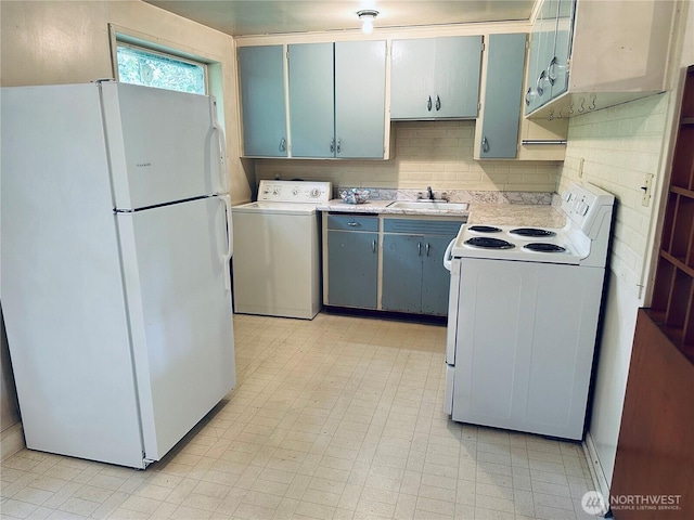 22907 60th Ave W, Mountlake Terrace, WA 98043 - kitchen with white appliances, washer / clothes dryer, a sink, light countertops, and blue cabinets