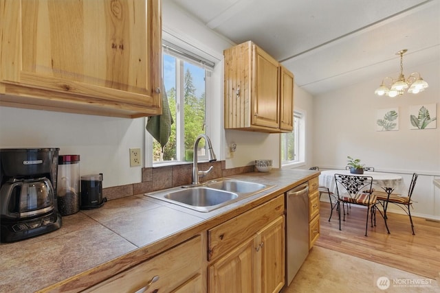 17913 51st St NW, Vaughn, WA 98394 - kitchen with a sink, stainless steel dishwasher, light brown cabinets, lofted ceiling, and tile counters