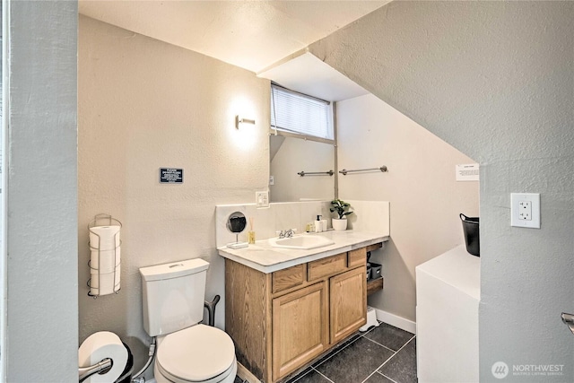 1934 NE Northgate Way, Seattle, WA 98125 - bathroom featuring tile patterned flooring, a textured wall, toilet, and vanity