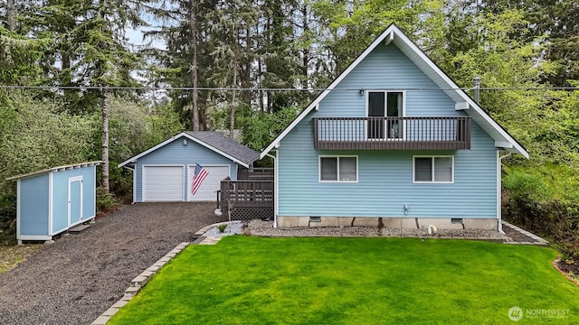 473 Mt Olympus Ave SE, Ocean Shores, WA 98569 - back of property with an outbuilding, a balcony, crawl space, a detached garage, and a yard