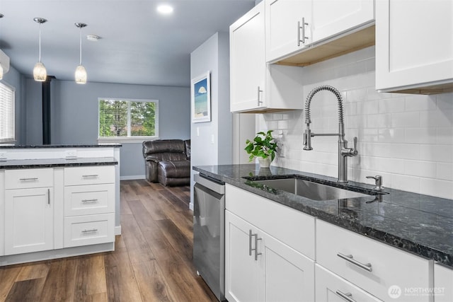 473 Mt Olympus Ave SE, Ocean Shores, WA 98569 - kitchen featuring a sink, stainless steel dishwasher, tasteful backsplash, dark wood finished floors, and white cabinets