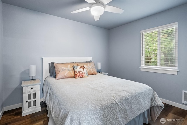 473 Mt Olympus Ave SE, Ocean Shores, WA 98569 - bedroom with baseboards, dark wood-style flooring, and ceiling fan